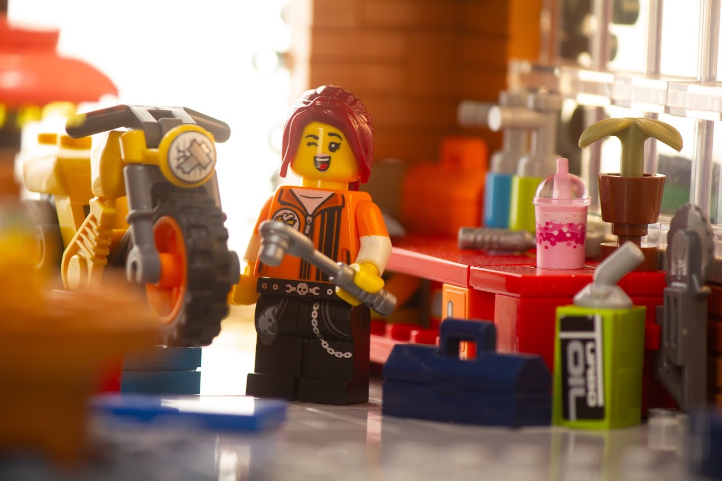 lego girl in a motorcycle garage.